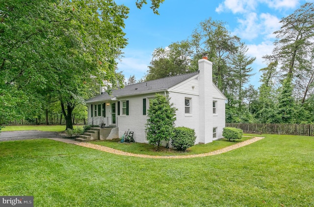 6001 Kroy Ct, Springfield, VA 22150 - view of side of home with a chimney and brick siding