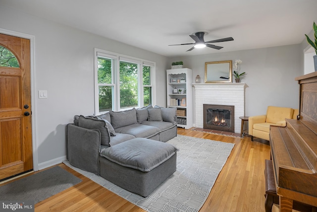 6001 Kroy Ct, Springfield, VA 22150 - living room with a fireplace, light wood finished floors, and ceiling fan
