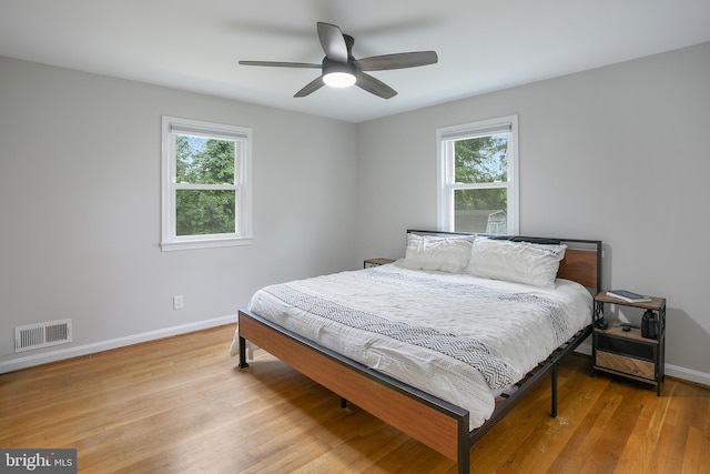 6001 Kroy Ct, Springfield, VA 22150 - bedroom featuring multiple windows, light wood finished floors, and ceiling fan