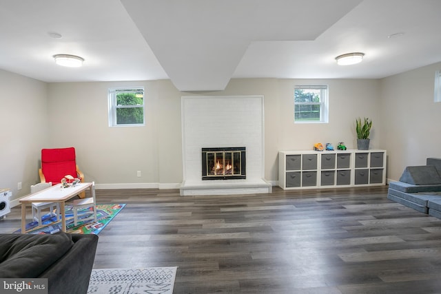6001 Kroy Ct, Springfield, VA 22150 - sitting room with plenty of natural light, wood finished floors, and a brick fireplace