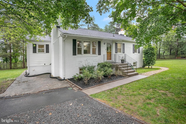 6001 Kroy Ct, Springfield, VA 22150 - view of front of home with brick siding, a chimney, and roof with shingles