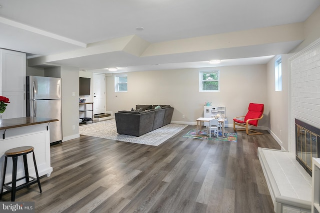 6001 Kroy Ct, Springfield, VA 22150 - living room with dark wood-style floors, heating unit, and a fireplace