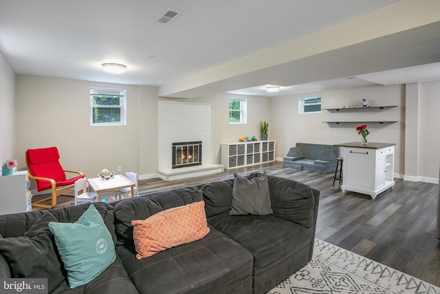 6001 Kroy Ct, Springfield, VA 22150 - living room featuring dark wood-type flooring, plenty of natural light, and a brick fireplace