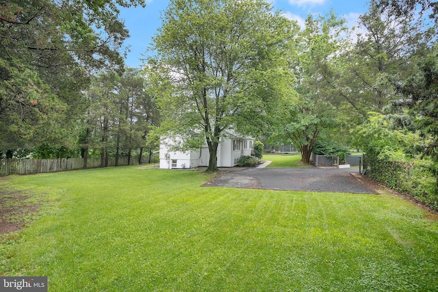 6001 Kroy Ct, Springfield, VA 22150 - view of yard featuring an outbuilding and a patio area