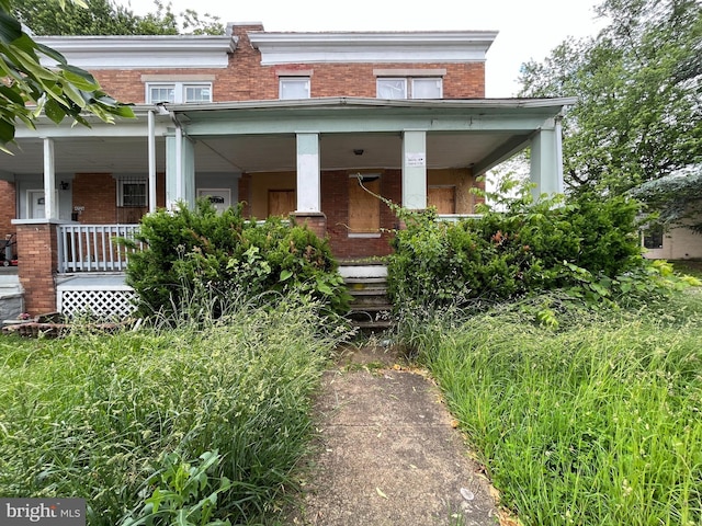 4728 York Rd, Baltimore, MD 21212 - view of front facade featuring brick siding and a porch