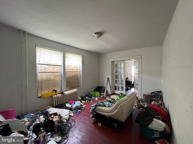 4728 York Rd, Baltimore, MD 21212 - bedroom featuring radiator heating unit, wood finished floors, and french doors