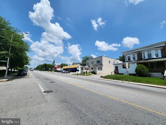 4728 York Rd, Baltimore, MD 21212 - view of asphalt road featuring curbs, street lights, and sidewalks