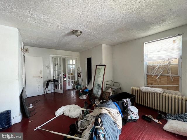 4728 York Rd, Baltimore, MD 21212 - dining space featuring radiator heating unit, french doors, a textured ceiling, and plenty of natural light
