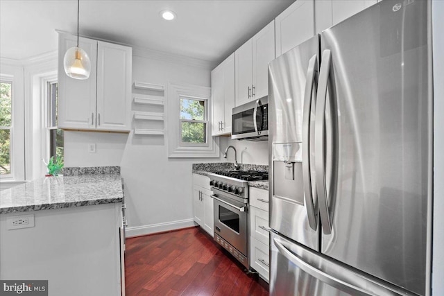 1832 Calvert St NW Unit 3, Washington, DC 20009 - kitchen with appliances with stainless steel finishes, healthy amount of natural light, white cabinets, dark wood finished floors, and ornamental molding