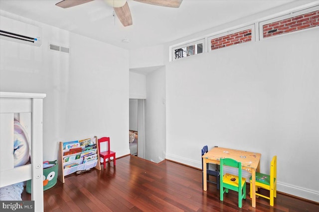 1832 Calvert St NW Unit 3, Washington, DC 20009 - rec room featuring hardwood / wood-style floors, a wall unit AC, ceiling fan, and baseboards