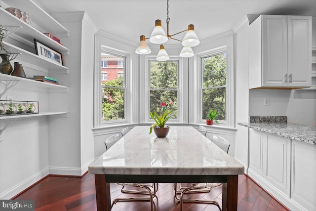1832 Calvert St NW Unit 3, Washington, DC 20009 - dining space with healthy amount of natural light, a chandelier, baseboards, dark wood-style floors, and ornamental molding