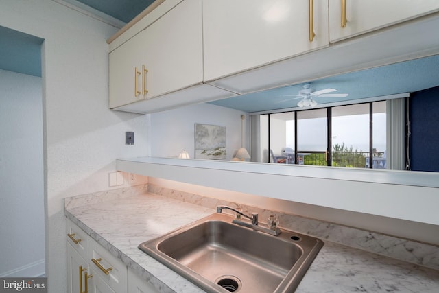 9500 Coastal Hwy Unit 1L, Ocean City, MD 21842 - kitchen with a sink, light countertops, a ceiling fan, and white cabinets
