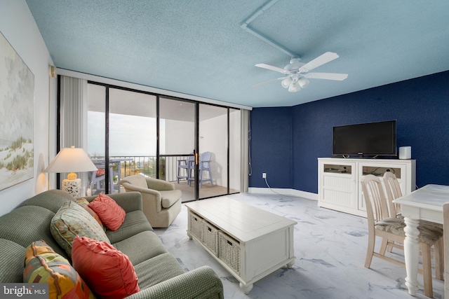 9500 Coastal Hwy Unit 1L, Ocean City, MD 21842 - living area featuring ceiling fan, a textured ceiling, expansive windows, and marble finish floors