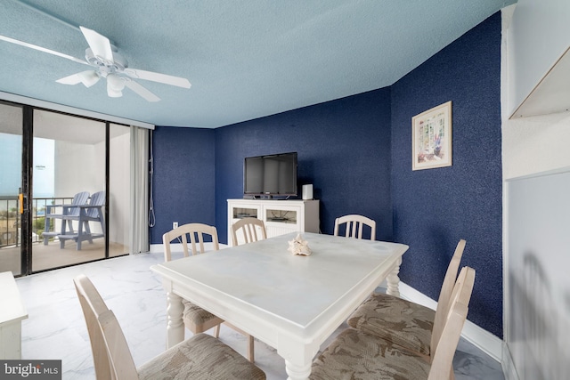 9500 Coastal Hwy Unit 1L, Ocean City, MD 21842 - dining area with marble finish floors, a ceiling fan, baseboards, and a textured ceiling