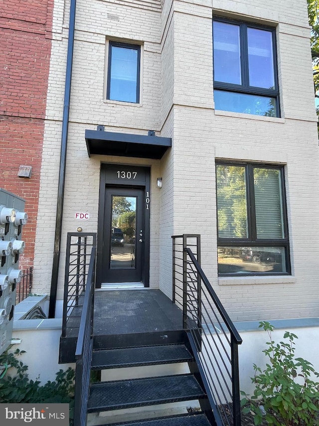 1307 K St SE Unit 101, Washington, DC 20003 - doorway to property featuring brick siding