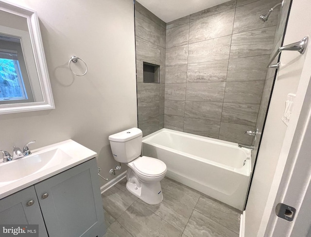 1307 K St SE Unit 101, Washington, DC 20003 - bathroom featuring vanity, toilet, baseboards, and shower / bath combination