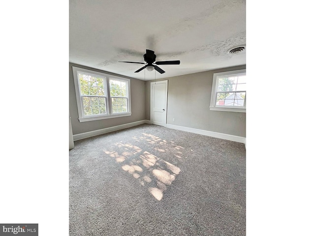 1045 S Bradford St, Dover, DE 19904 - unfurnished bedroom featuring carpet, a ceiling fan, and a closet