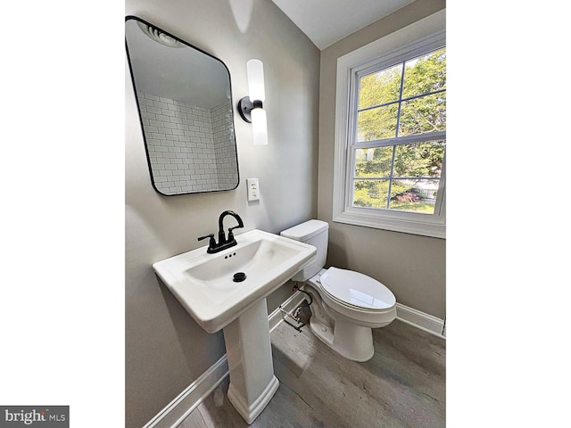 1045 S Bradford St, Dover, DE 19904 - bathroom featuring wood finished floors and baseboards
