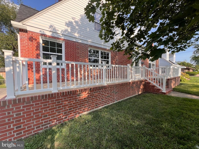 1045 S Bradford St, Dover, DE 19904 - rear view of property with brick siding and a yard