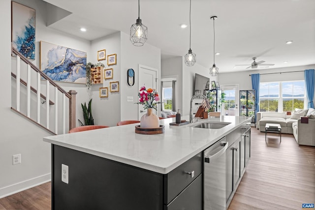 820 Swede St, Charlottesville, VA 22901 - kitchen with a sink, dishwasher, a center island with sink, wood finished floors, and open floor plan