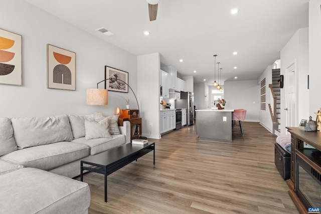 820 Swede St, Charlottesville, VA 22901 - living room with ceiling fan, light wood-style flooring, recessed lighting, and baseboards