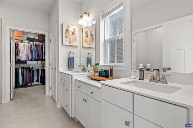 820 Swede St, Charlottesville, VA 22901 - bathroom with vanity, tile patterned flooring, and a walk in closet
