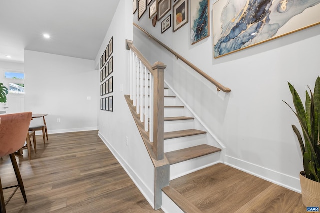 820 Swede St, Charlottesville, VA 22901 - staircase featuring wood finished floors, baseboards, and recessed lighting