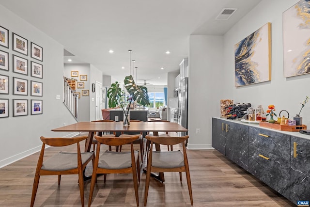 820 Swede St, Charlottesville, VA 22901 - dining space with wood finished floors, stairs, recessed lighting, and baseboards