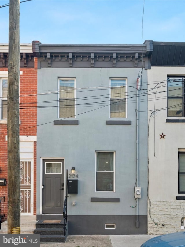 2174 E Oakdale St, Philadelphia, PA 19125 - view of front facade featuring stucco siding