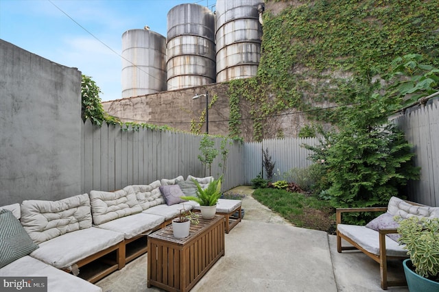 2174 E Oakdale St, Philadelphia, PA 19125 - fenced backyard featuring an outdoor hangout area and a patio area