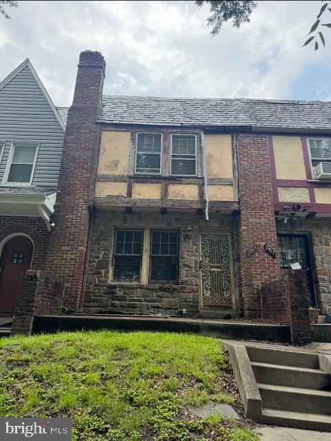 2915 Gwynns Falls Pkwy, Baltimore, MD 21216 - view of front of property with a chimney, cooling unit, and stone siding