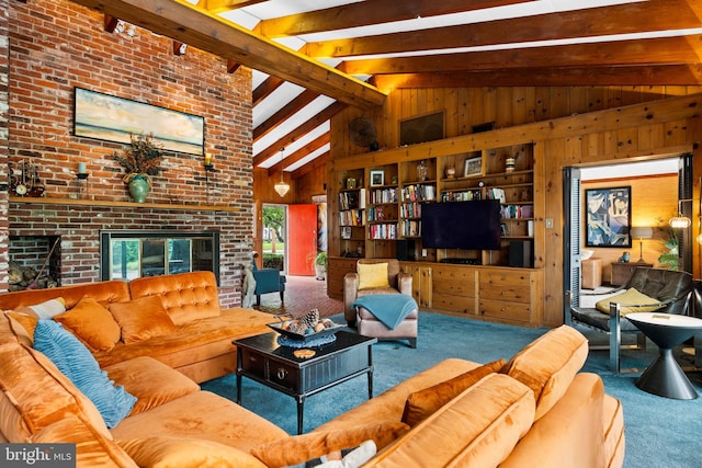 320 S Main St, Quakertown, PA 18951 - carpeted living area with wooden walls, beamed ceiling, a fireplace, and high vaulted ceiling