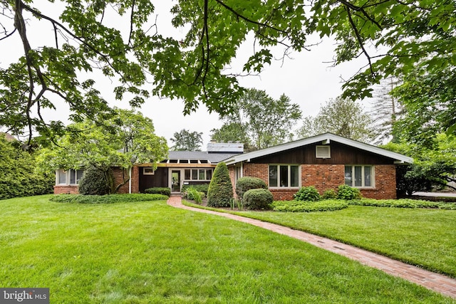320 S Main St, Quakertown, PA 18951 - view of front of home featuring brick siding and a front yard