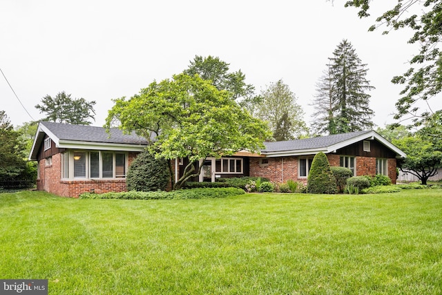 320 S Main St, Quakertown, PA 18951 - view of front of property with brick siding and a front yard