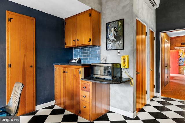 320 S Main St, Quakertown, PA 18951 - kitchen featuring tile patterned floors, stainless steel microwave, brown cabinetry, and dark countertops