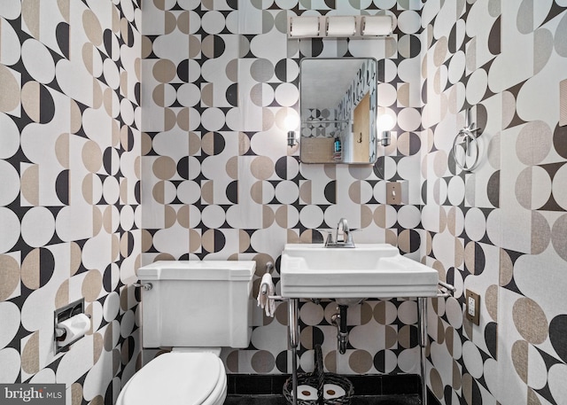 320 S Main St, Quakertown, PA 18951 - half bathroom featuring wallpapered walls and toilet