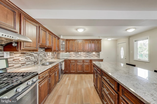 3603 John Ct, Annandale, VA 22003 - kitchen featuring a sink, stainless steel appliances, backsplash, and light stone counters