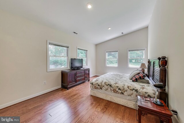 3603 John Ct, Annandale, VA 22003 - bedroom with multiple windows, vaulted ceiling, light wood-style floors, baseboards, and recessed lighting