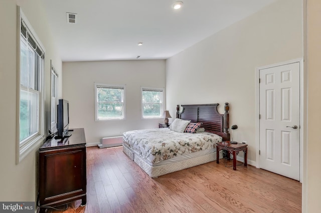 3603 John Ct, Annandale, VA 22003 - bedroom with wood finished floors, lofted ceiling, and baseboards