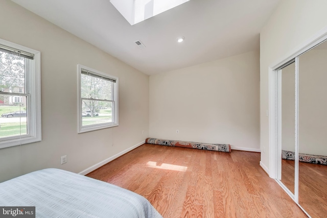 3603 John Ct, Annandale, VA 22003 - bedroom with wood finished floors, a skylight, baseboards, a closet, and recessed lighting