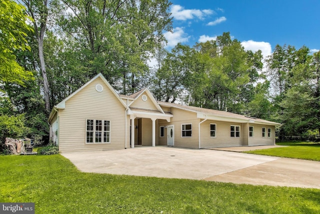 3603 John Ct, Annandale, VA 22003 - view of front of home with concrete driveway, a front lawn, a patio, and view of wooded area