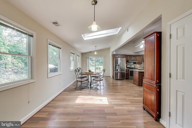 3603 John Ct, Annandale, VA 22003 - dining space with a skylight, healthy amount of natural light, vaulted ceiling, light wood finished floors, and ceiling fan