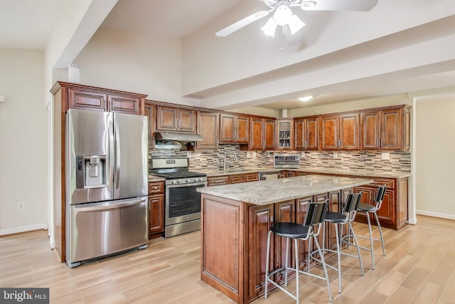 3603 John Ct, Annandale, VA 22003 - kitchen featuring stainless steel appliances, light wood-style flooring, and backsplash