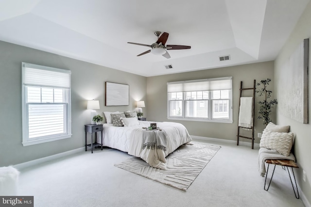 2177 S Glebe Rd, Arlington, VA 22204 - carpeted bedroom with a tray ceiling, baseboards, and a ceiling fan