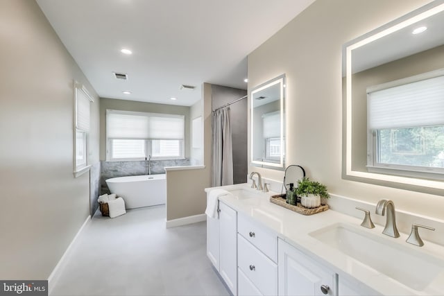 2177 S Glebe Rd, Arlington, VA 22204 - full bath with a freestanding tub, double vanity, baseboards, and a shower with curtain