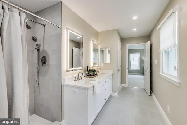 2177 S Glebe Rd, Arlington, VA 22204 - full bath with a tile shower, double vanity, baseboards, and recessed lighting