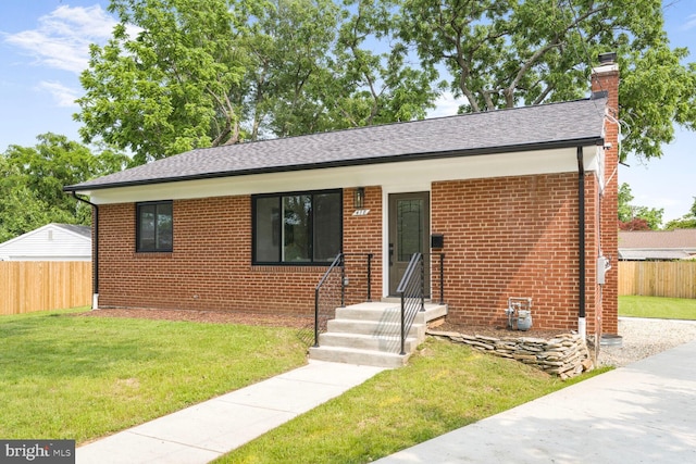 418 Belton Ct, Silver Spring, MD 20901 - view of front of home featuring a chimney, brick siding, and roof with shingles