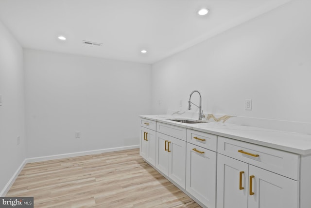 418 Belton Ct, Silver Spring, MD 20901 - washroom with a sink, light wood-style floors, recessed lighting, and baseboards