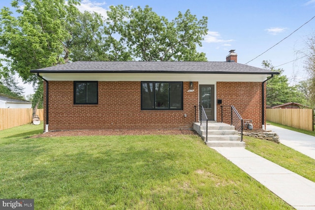 418 Belton Ct, Silver Spring, MD 20901 - view of front of home with a chimney, brick siding, and roof with shingles