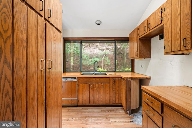 475 Arden, Gulph Mills, PA 19428 - kitchen with wooden counters, dishwasher, light wood-style floors, and brown cabinetry